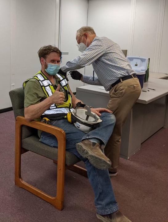 Valley Road construction workers get vaccinated while at work