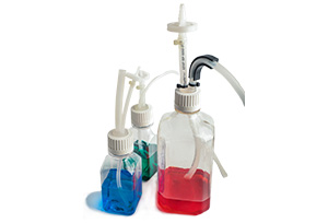 Image of 3 bottles with Bioclosures with various color liquids in the bottles, on a white background